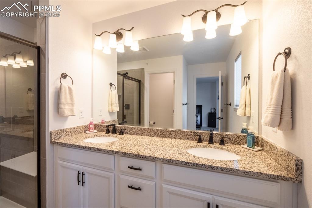 Primary 3/4 bathroom (3) with dual sinks - upper floor