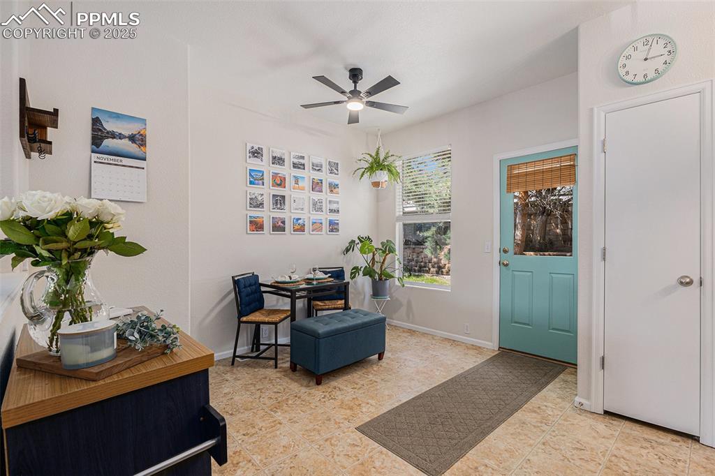Dining space with updated lighting and ceiling fan