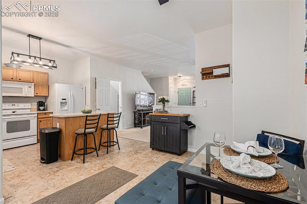 Dining space with updated lighting and ceiling fan
