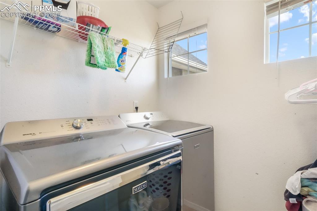 Washroom featuring washer and dryer