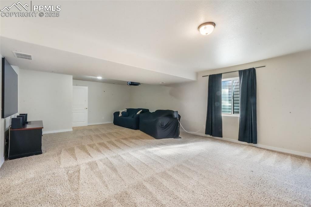 Unfurnished room featuring light colored carpet