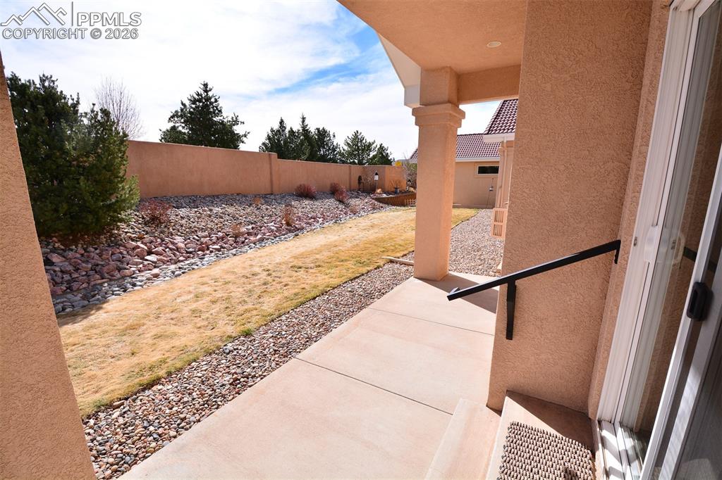 Covered patio in back of home