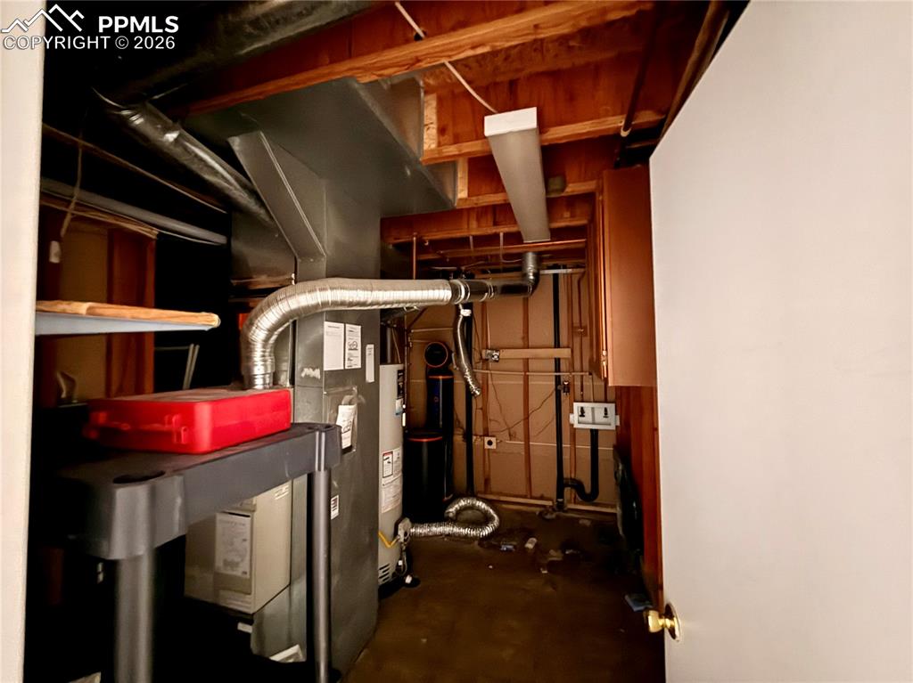 Utility room with gas water heater