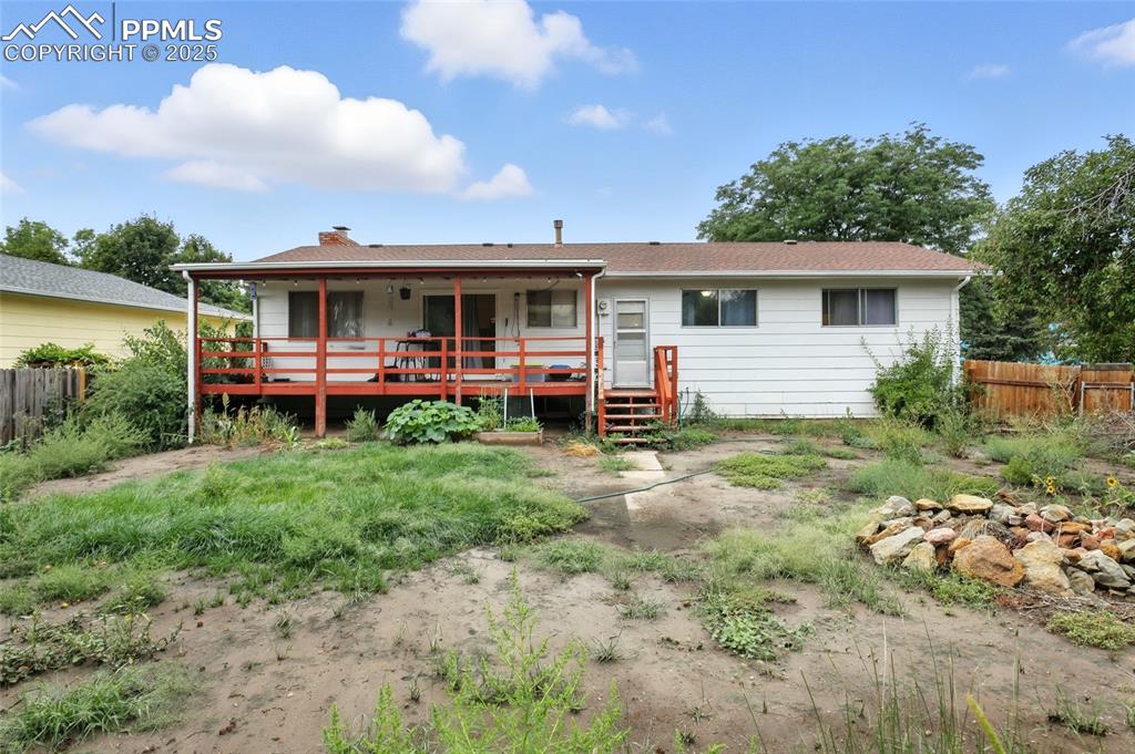 Back of property featuring a chimney