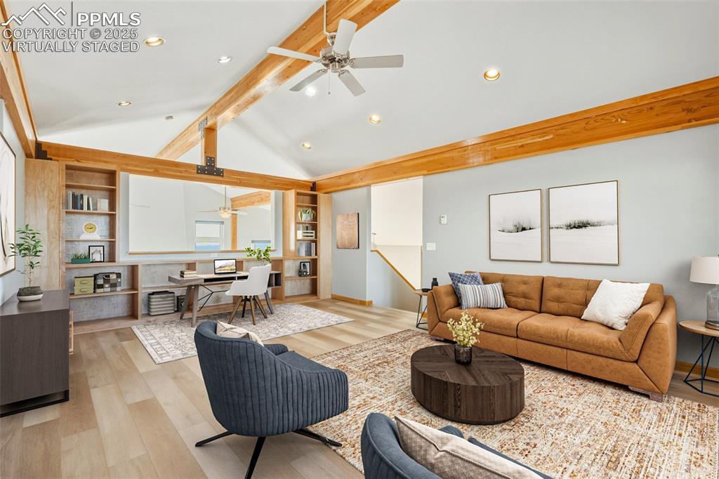 Virtually Staged -Living area featuring ceiling fan, wood finished floors, recessed lighting, and built in features