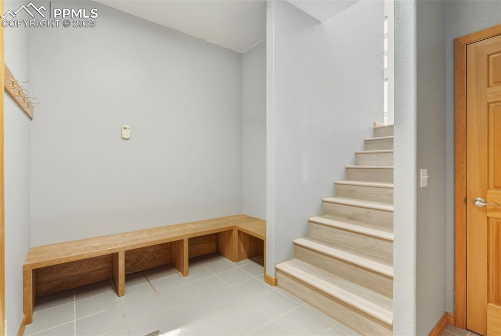 Mudroom featuring light tile patterned flooring
