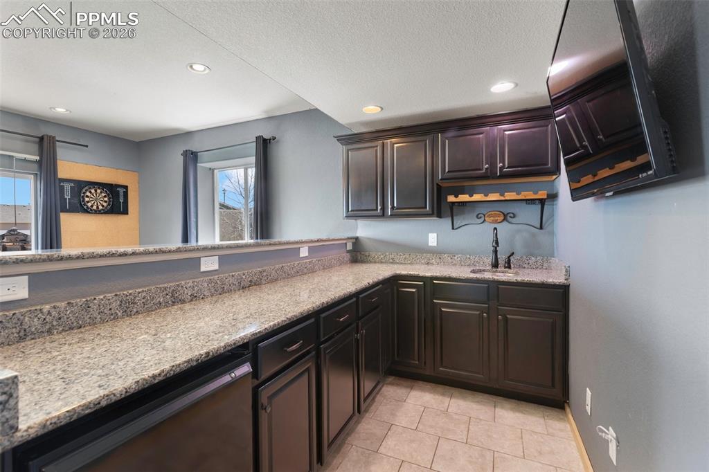Convenient wet bar that adds style to the basement