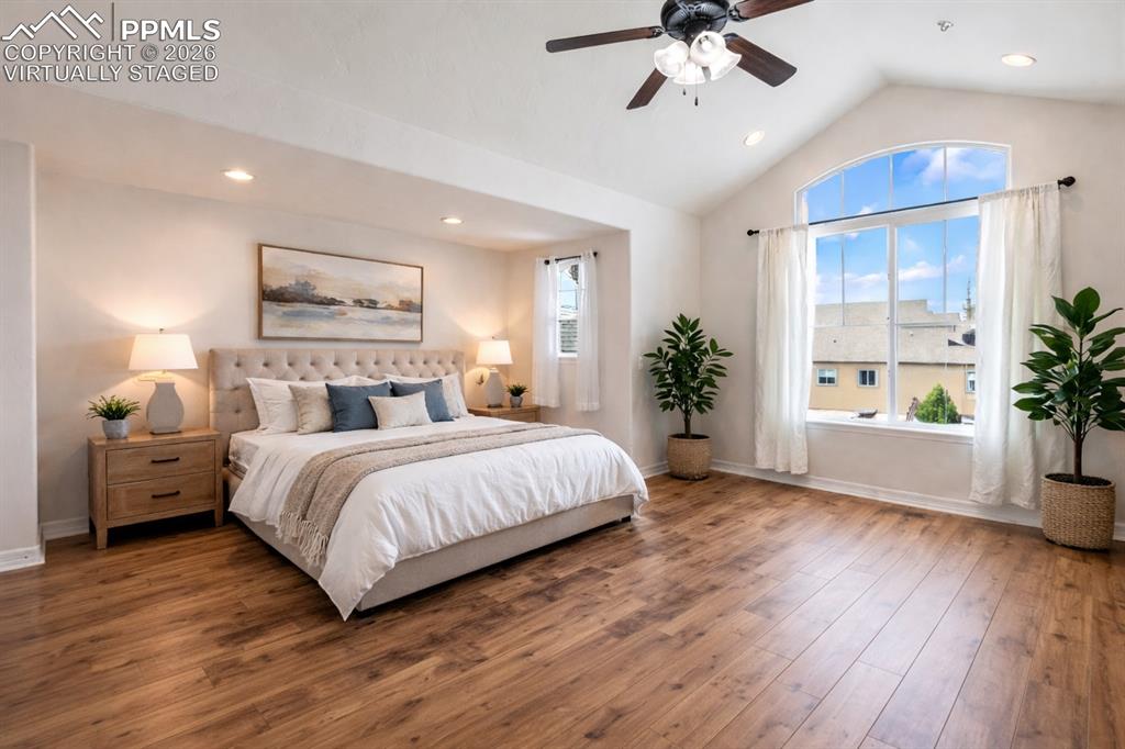 Generous primary bedroom with large windows (Virtually Staged)