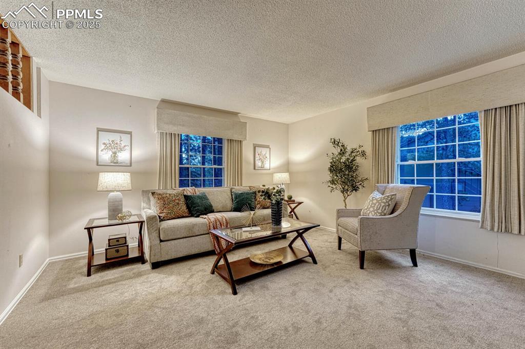 Large windows in the formal Living Room provide tons of natural light throughout the entire space.