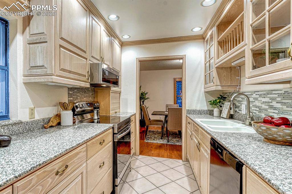 The Kitchen is conveniently located off the Dining Room for easy food service and clean-up.