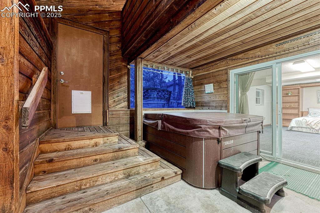 Newer hot tub in the indoor pool room located off the Finished Basement.