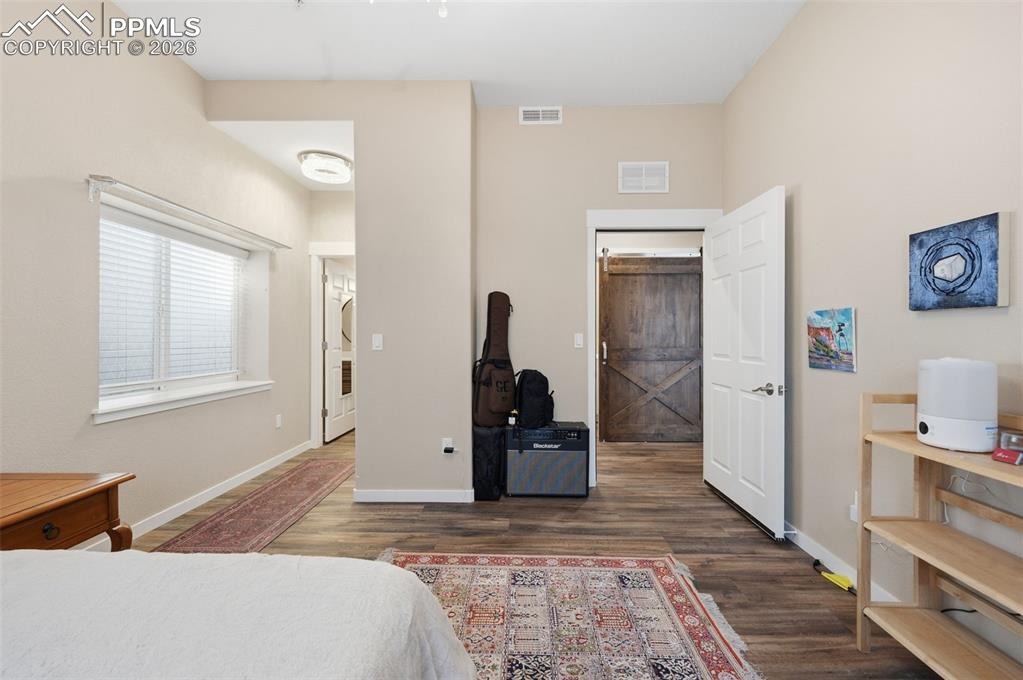 Bedroom #8 with private half bath on the left and entrance to the hall on the right