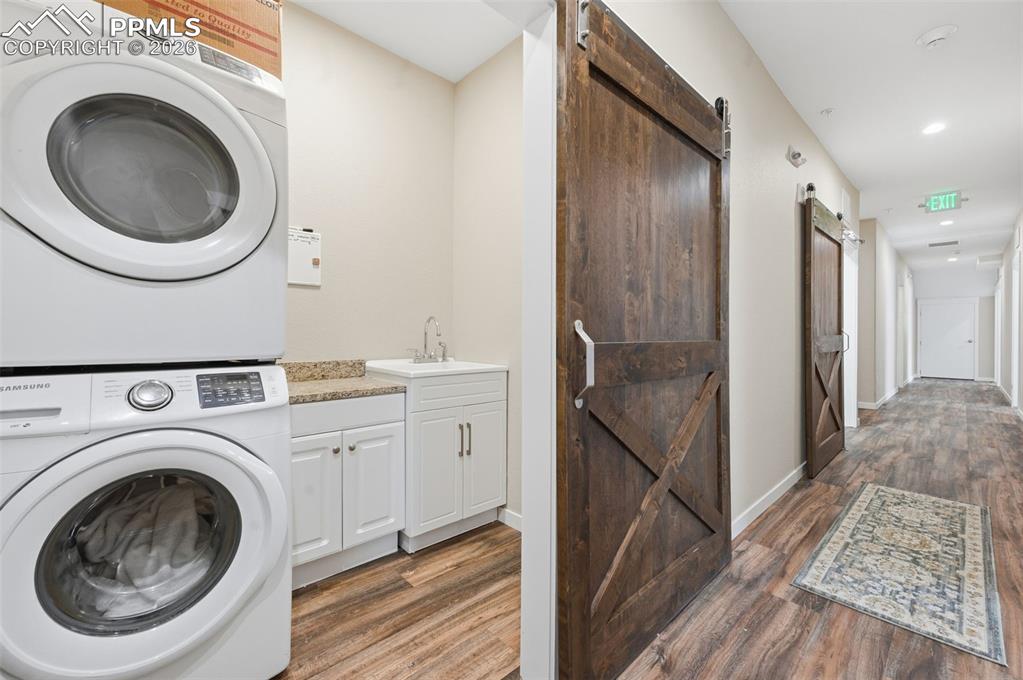 Laundry room with soaking tub on the lower level