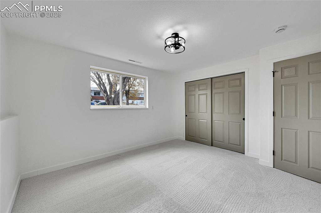 Unfurnished bedroom with carpet floors and a closet