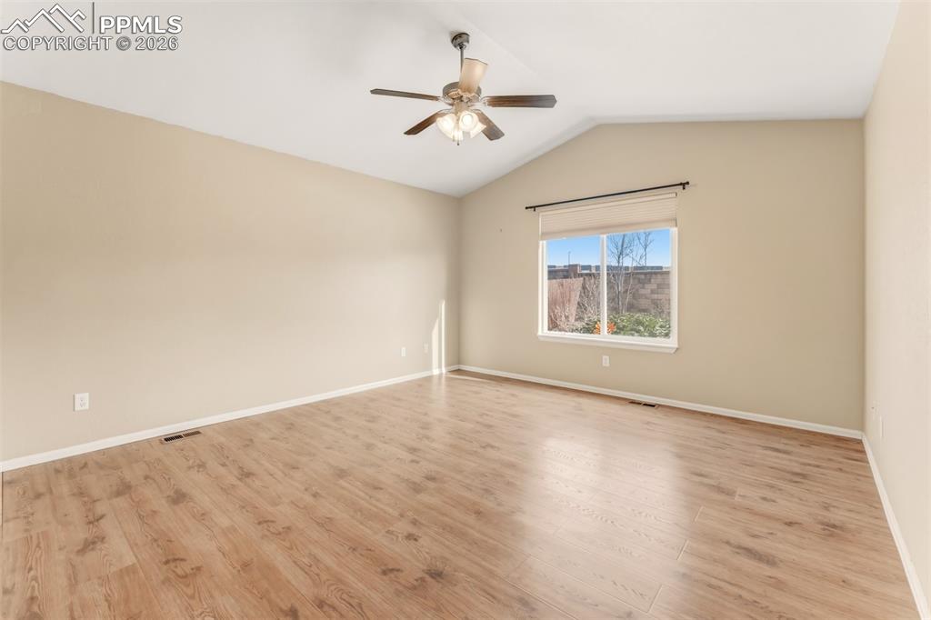 Primary bathroom with dual sinks, granite countertops and large walk-in closet.