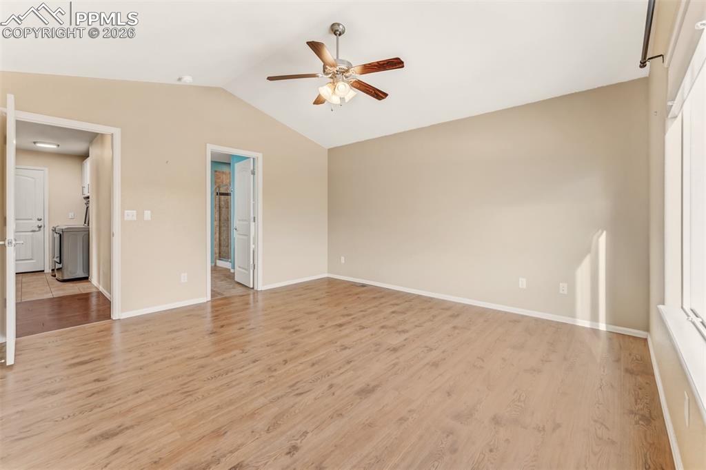 Primary bathroom with soaking tub and separate shower.