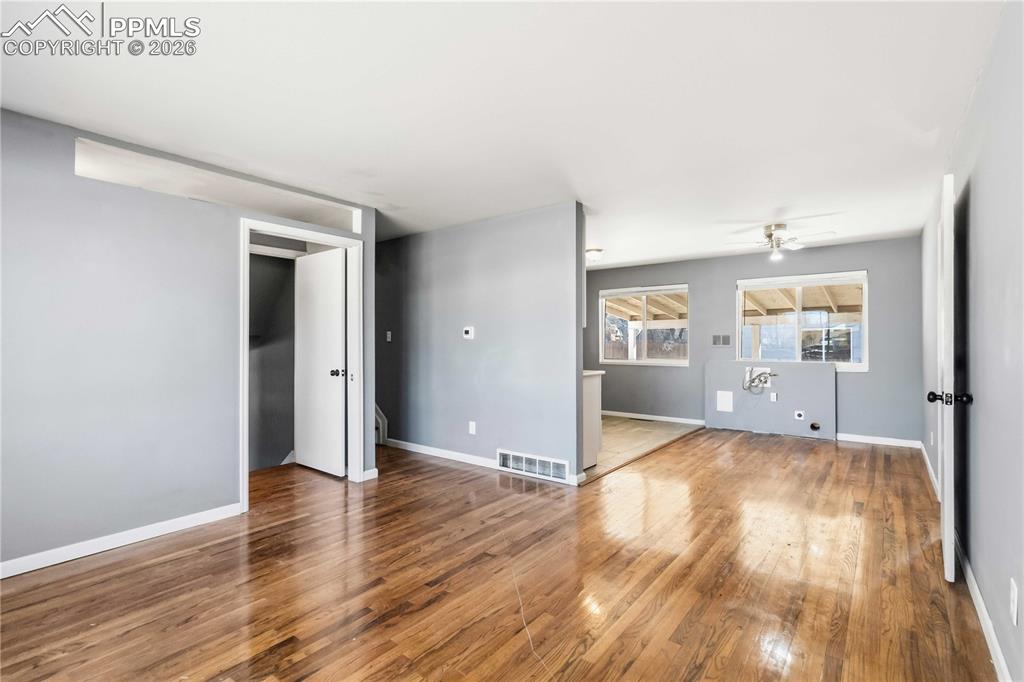 Living room off entryway flows to dining area and kitchen.