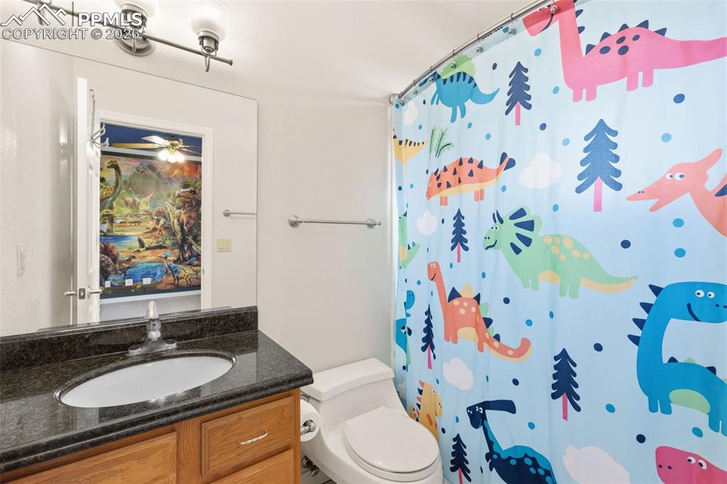 Full bath with vanity and curtained shower