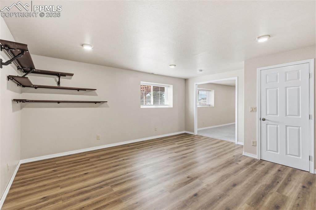 Basement featuring light wood finished floors