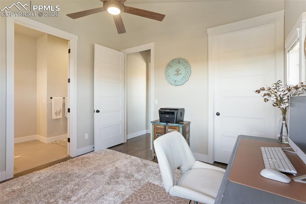 office or bedroom space with walk in closet and attached bathroom