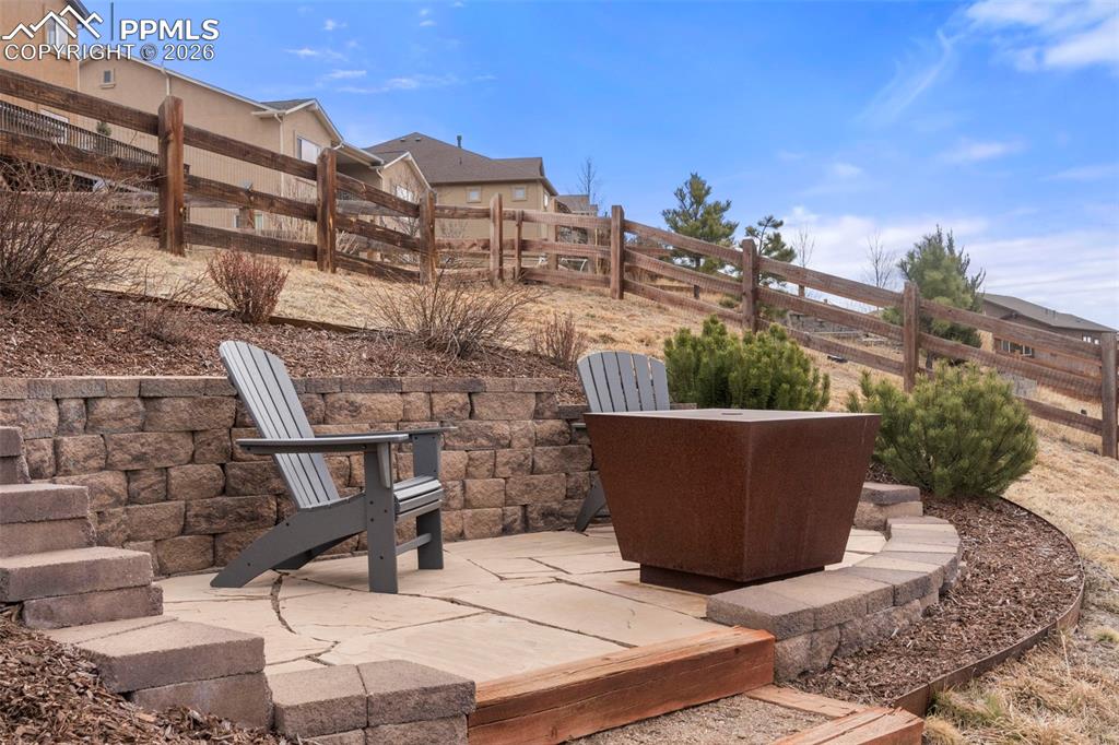 sitting area in the backyard at the top of steps