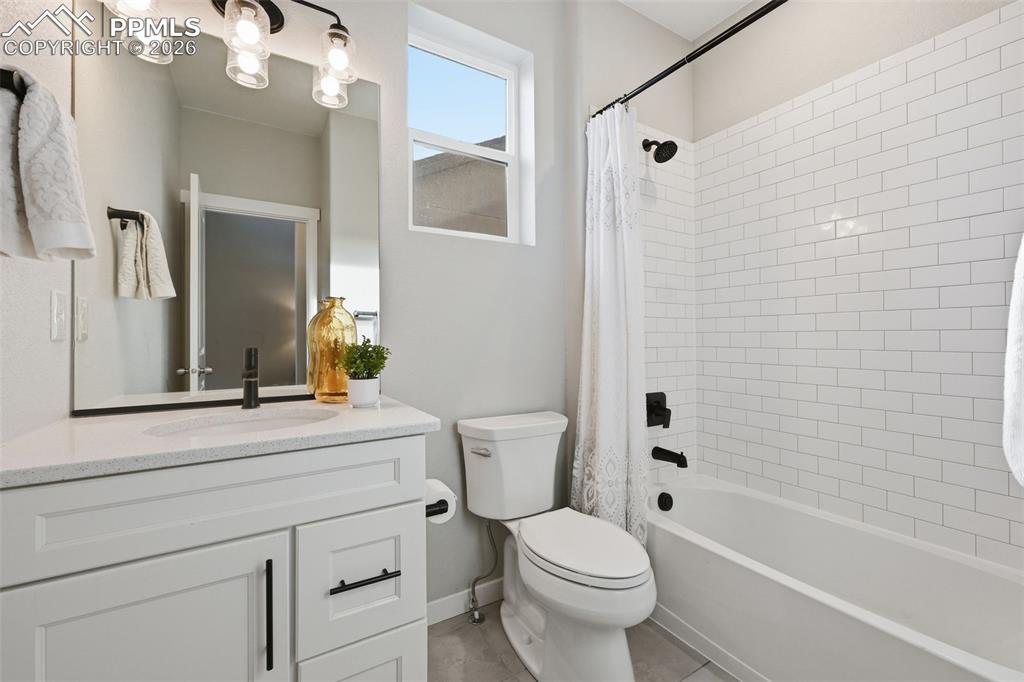 Full bath off of entryway, near main level bedroom