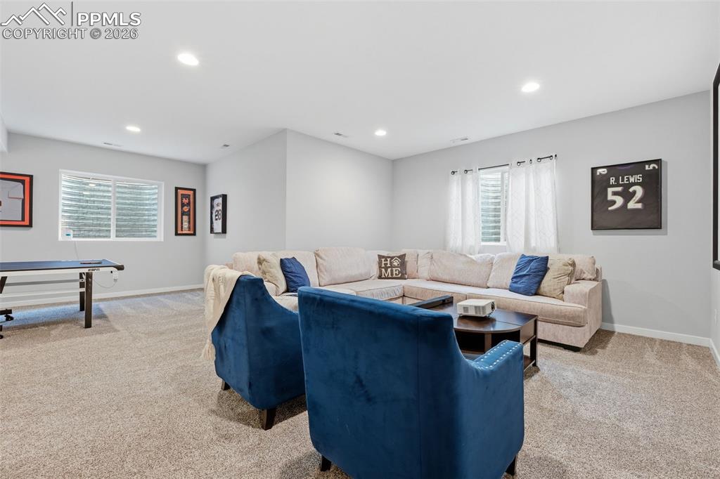 Basement with large windows letting in tons of natural light