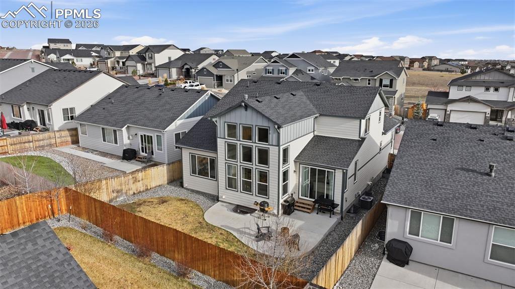 Fully fenced in back yard with sod and rocks