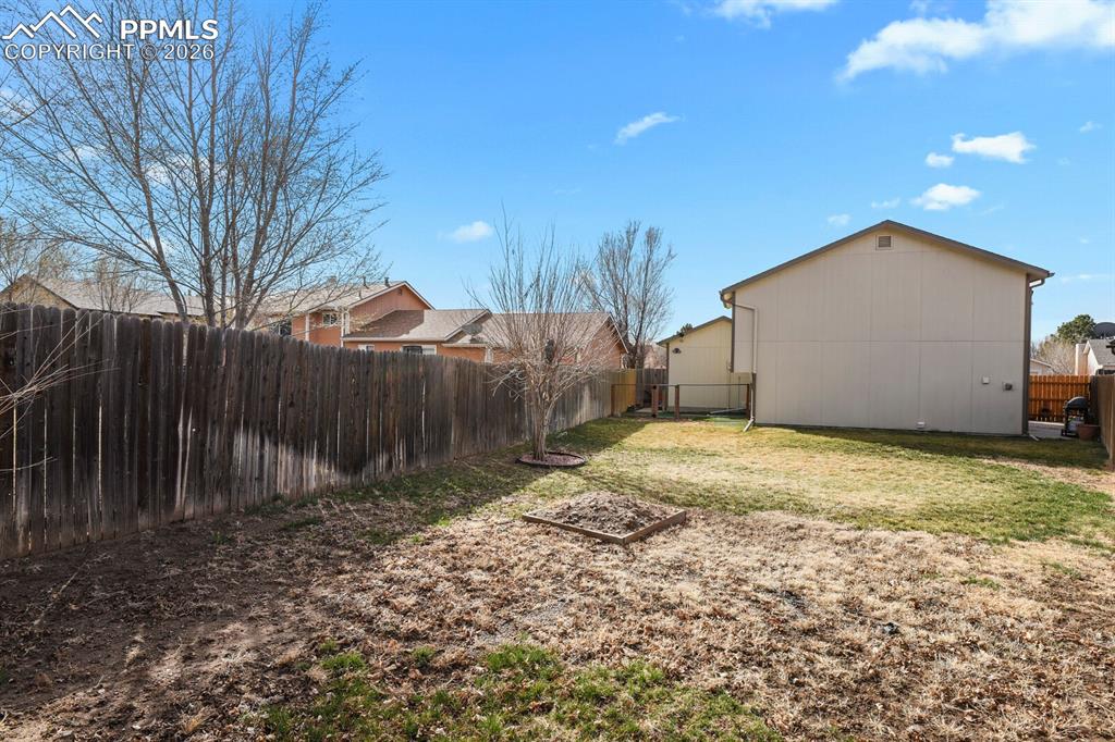 View of fenced backyard