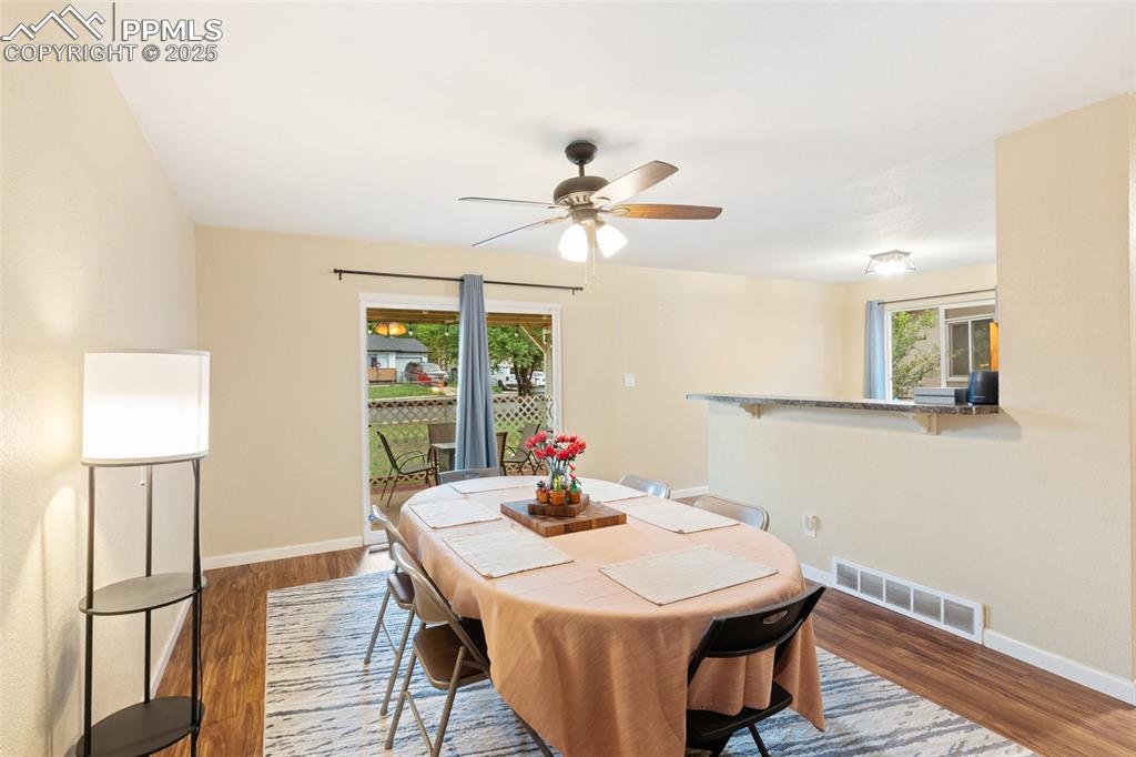 Dining room featuring wood finished floors and a ceiling fan