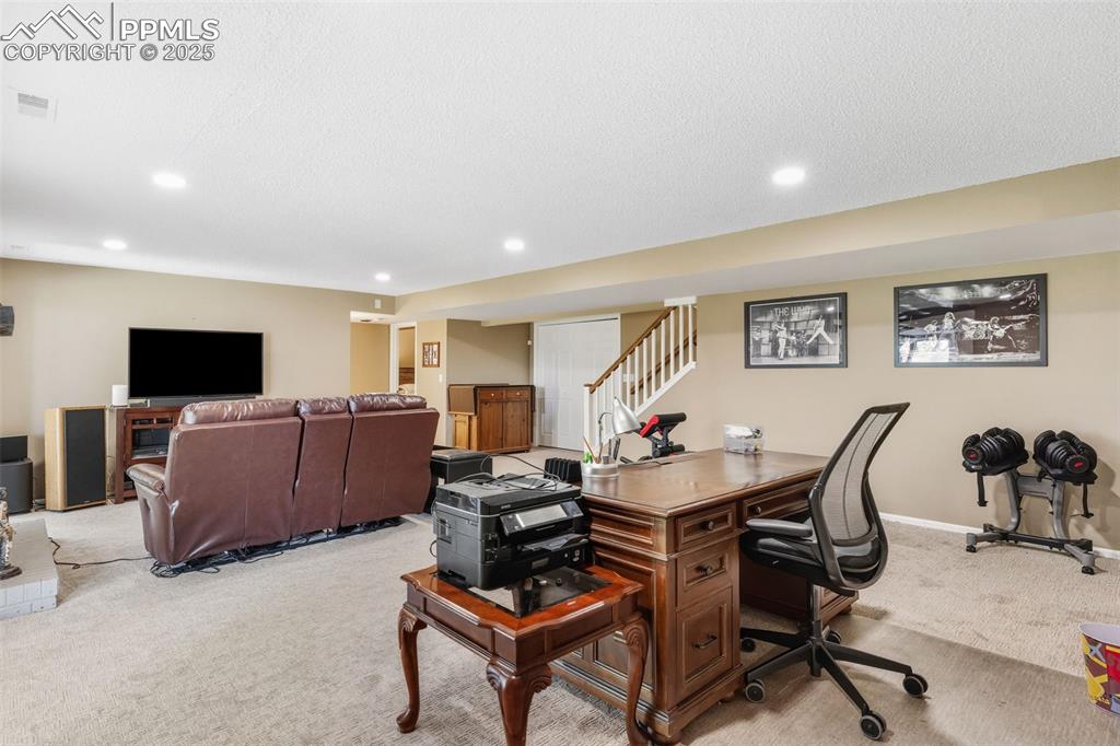 Huge lower level family room with space for an office