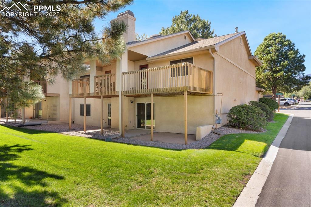 Patio connects to green space behind condo