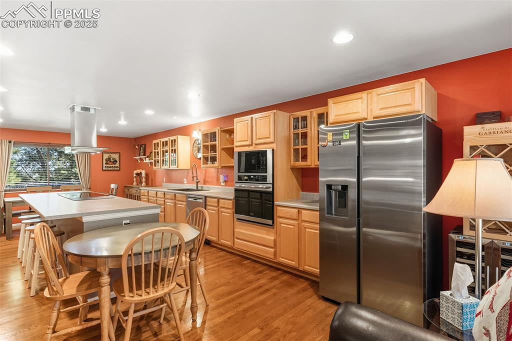 Kitchen with all appliances, kitchen island, and lots of windows