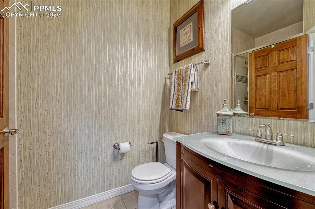 Main-level 3/4 bathroom with custom glass basin