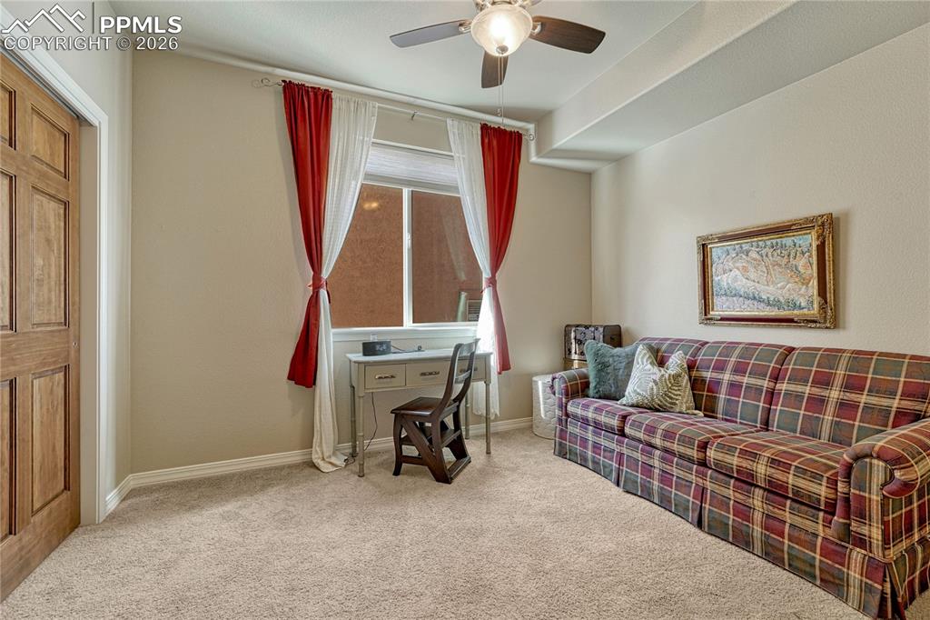 Main-level bedroom with natural light, ideal for guests or an office