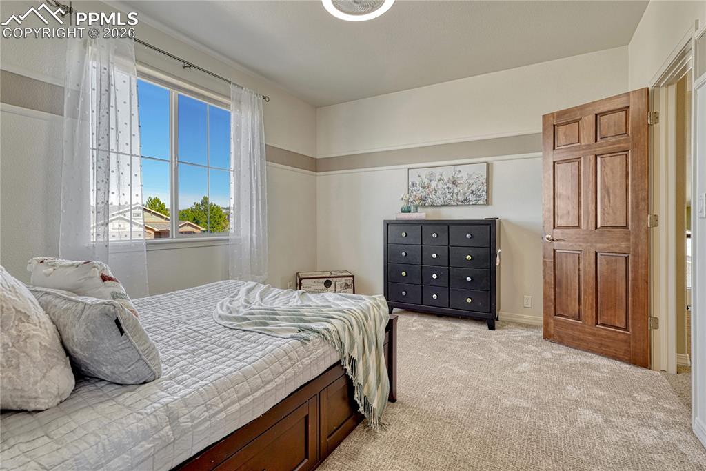 Upper-level bedroom with brand new carpet