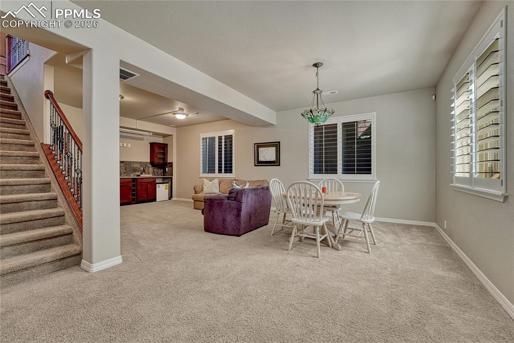 Head downstairs to the finished basement with a large flexible living space