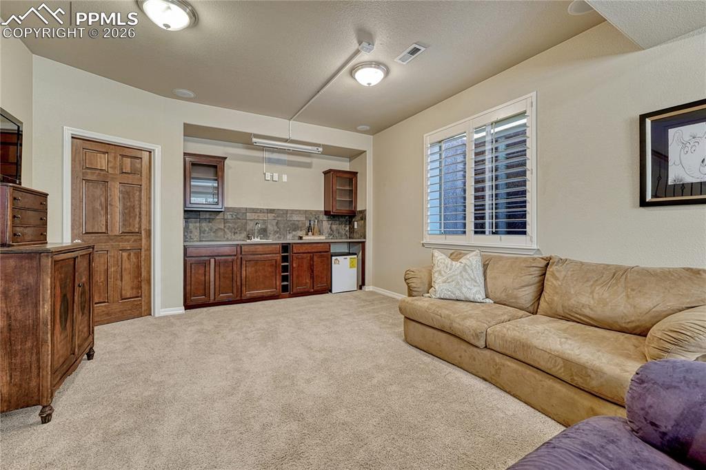 Basement wet bar for entertaining; fully wired surround sound system and projection capabilities