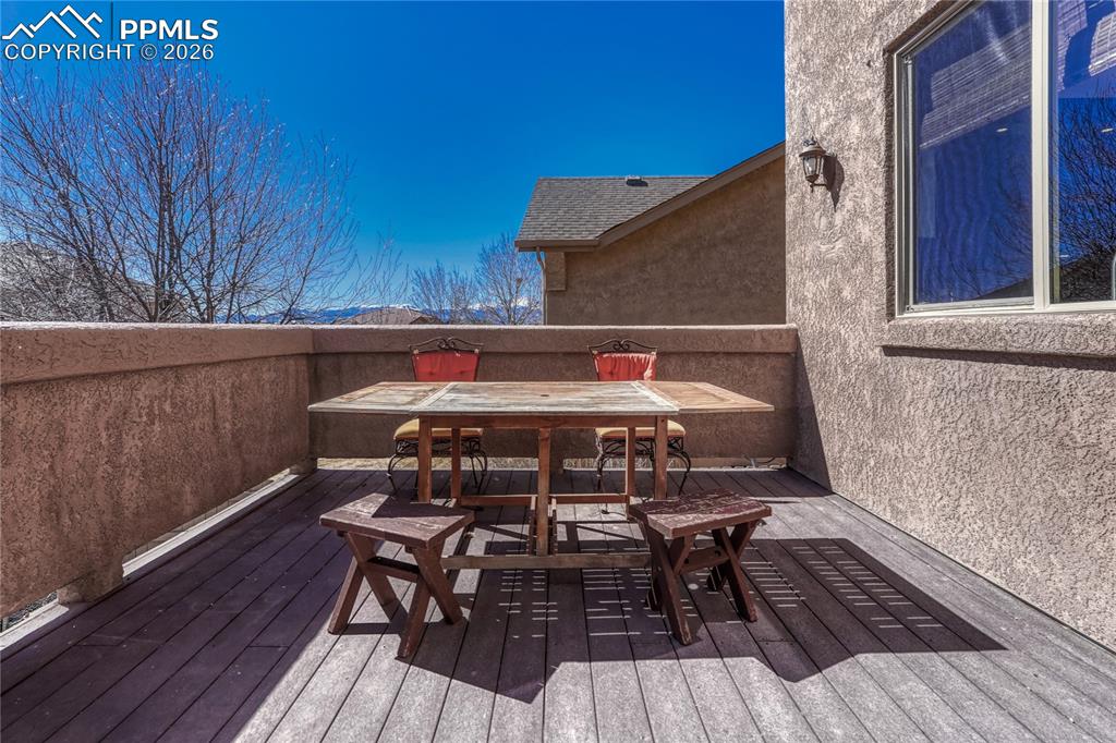 Head out from the dining area on the main level to the composite deck overlooking the fenced backyard