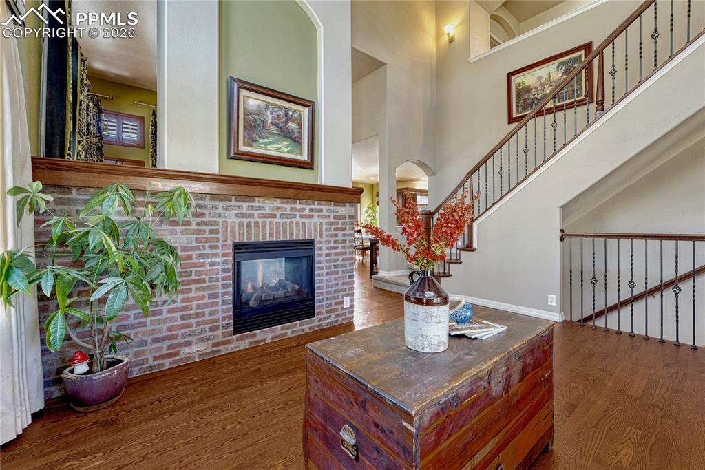 The two-sided fireplace connects the living room and family room