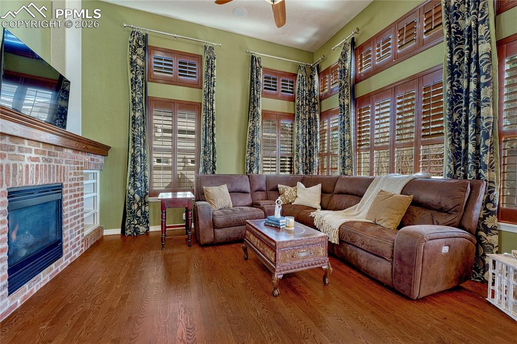 Two-story windows with plantation shutters for natural light control
