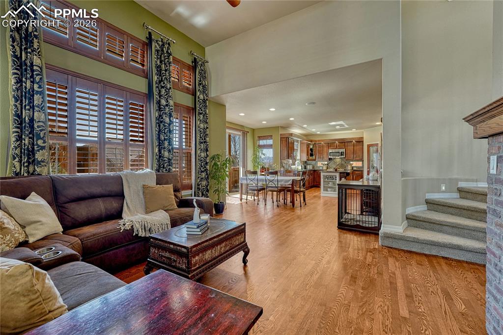 An open layout floor plan connects the family room, dining area and kitchen