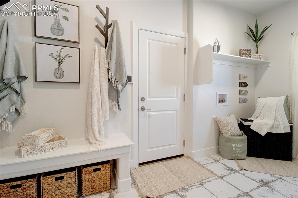 Mudroom featuring baseboards