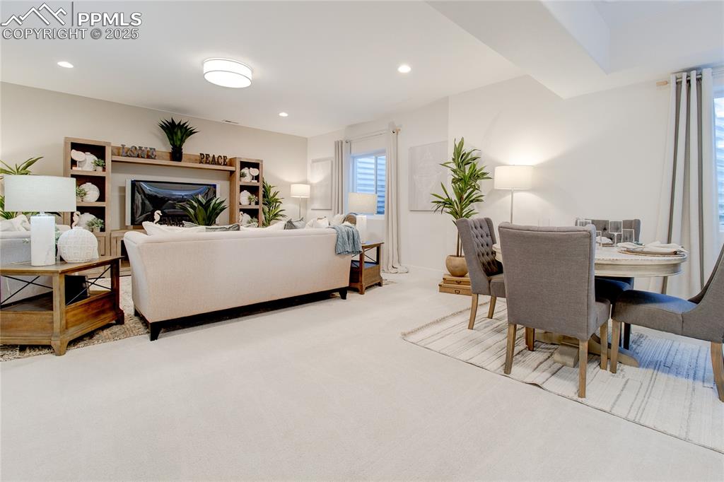 Living area featuring carpet and recessed lighting