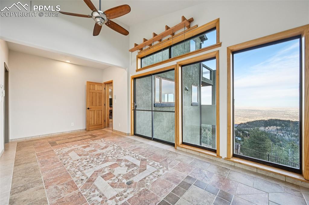 Sun room on the main level equipped with drainage and views!