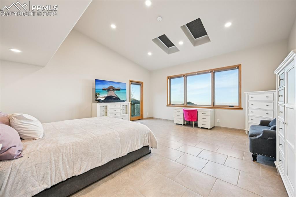 Primary bedroom with its own private walk out, en suite 5 piece bathroom, sitting area and skylights