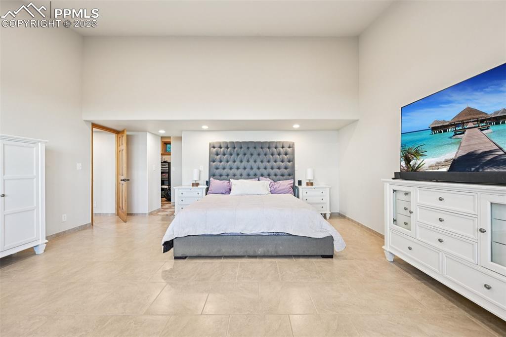 Primary bedroom with its own private walk out, en suite 5 piece bathroom, sitting area and skylights