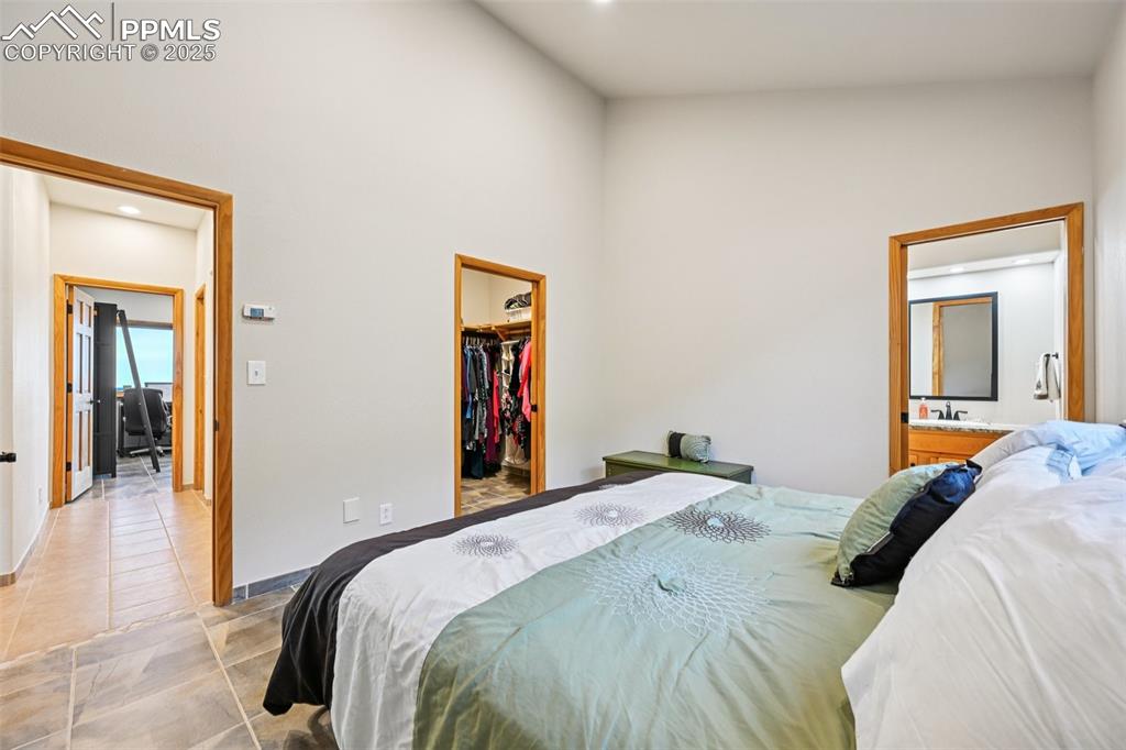 bedroom 3 with walk in closet and en suite full bathroom