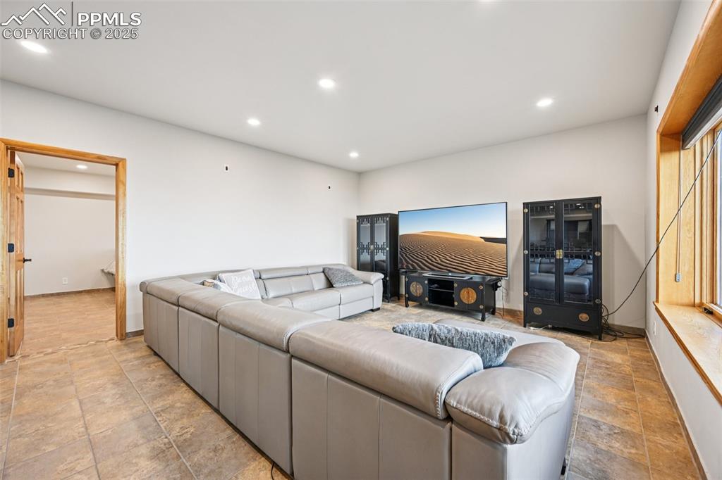 Recreation room on the lower level with a walk out to covered back patio