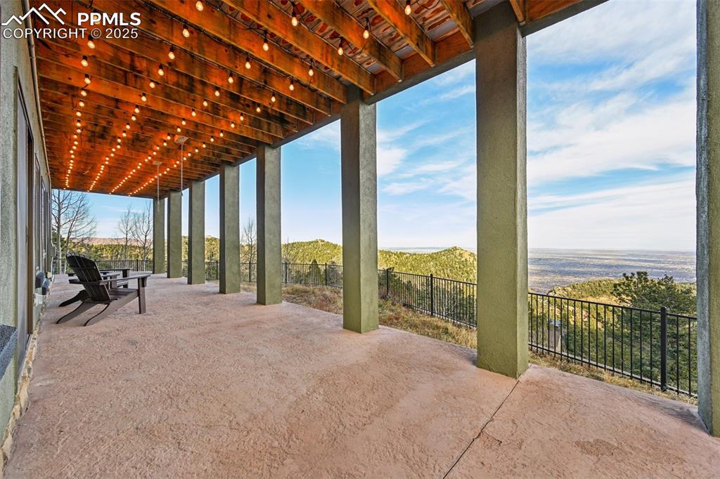 Covered patio off the lower level with dog run
